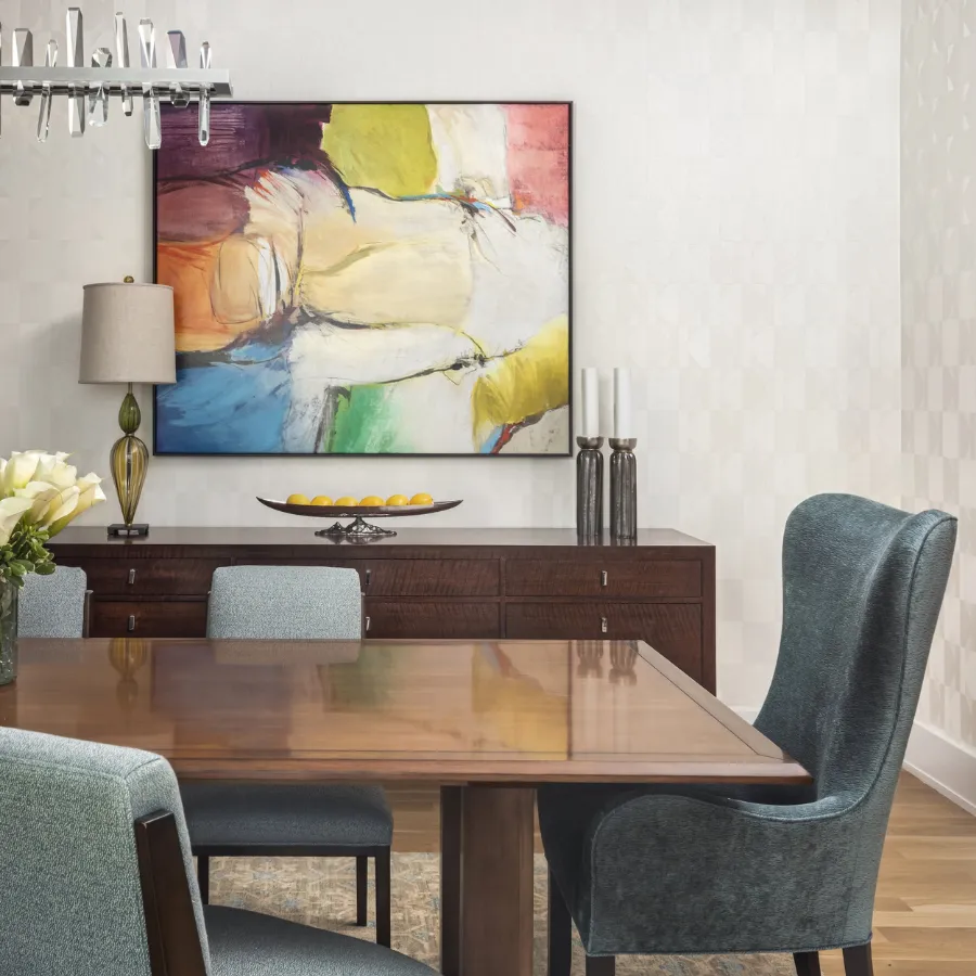 In this dining room by A. Houck Designs, Flair adds subtle texture and tonal geometry—quietly supporting bold art while enriching the space with tailored ease.