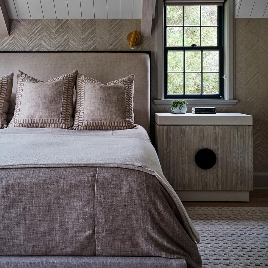 Reed creates a sweeping vertical movement that appears seamless on the wall. A specialty wallcovering, this adds sophistication and luxury to any spaces, including this bedroom.