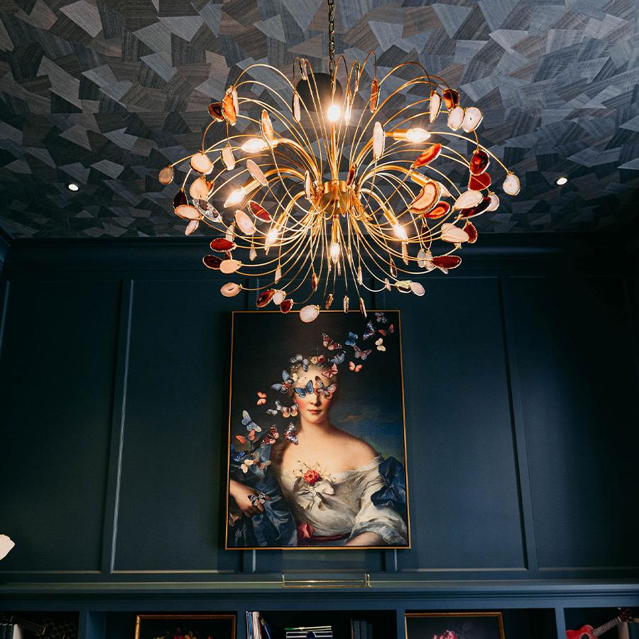 Hand-cut wood veneers are meticulously crafted and arranged to form distinctive patterns in Origami. Black Sheep Interiors uses this wallcovering on the ceiling of the space to create and intriguing ambaince, infusing the room with depth and dimension,